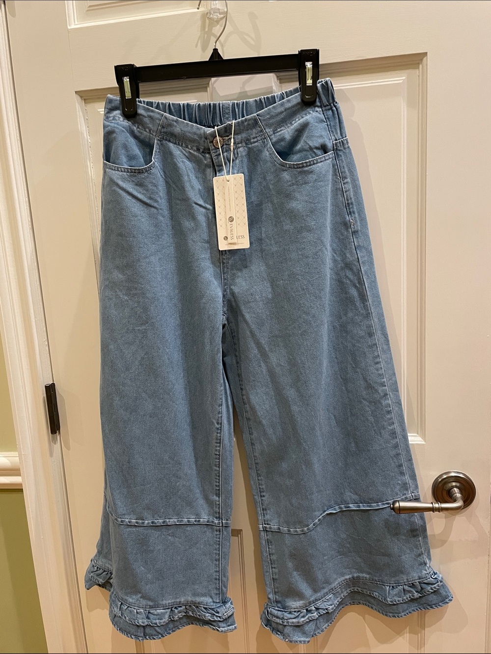Evaless Womenโs Light Blue Wide-Leg Ruffle Hem Jeans